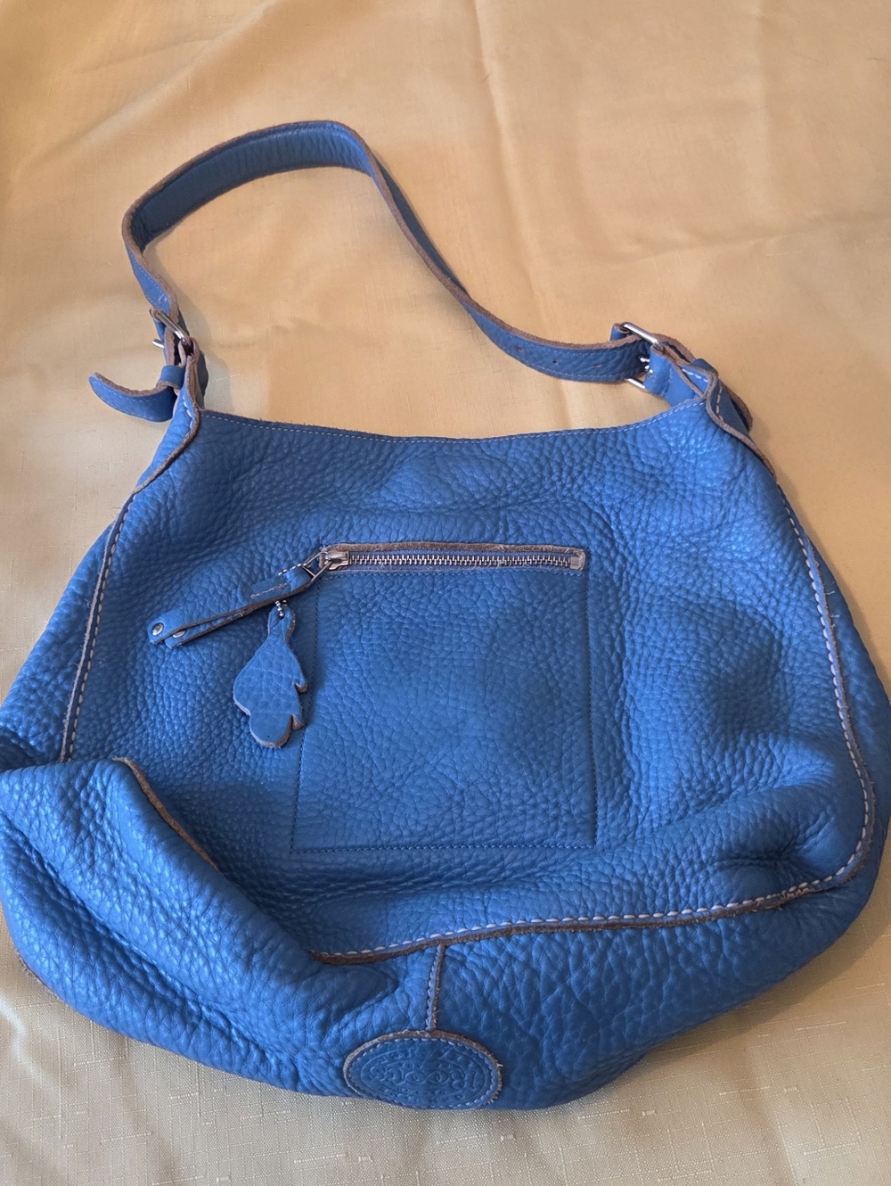The ROOTS Blue Pebbled Leather Shoulder Bag